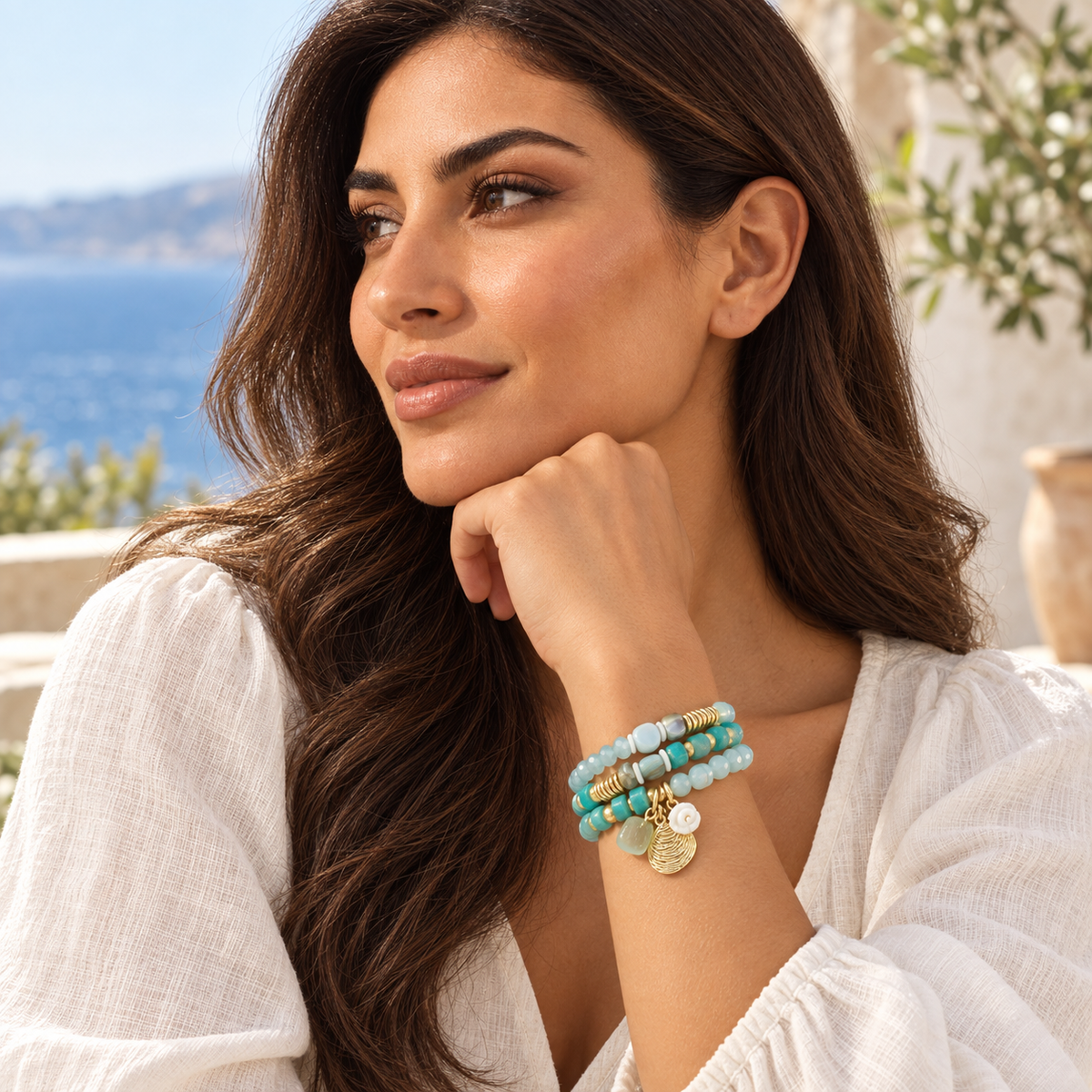 Woman wearing the Azzurra Tide turquoise triple-wrap bracelet
