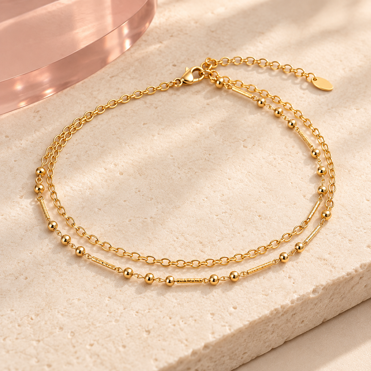 Gold-tone double-layer bead and link anklet on ivory stone