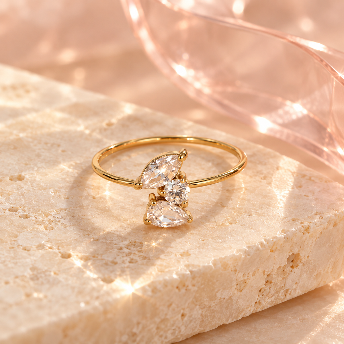Gold-tone open ring with three clear crystals in a cluster