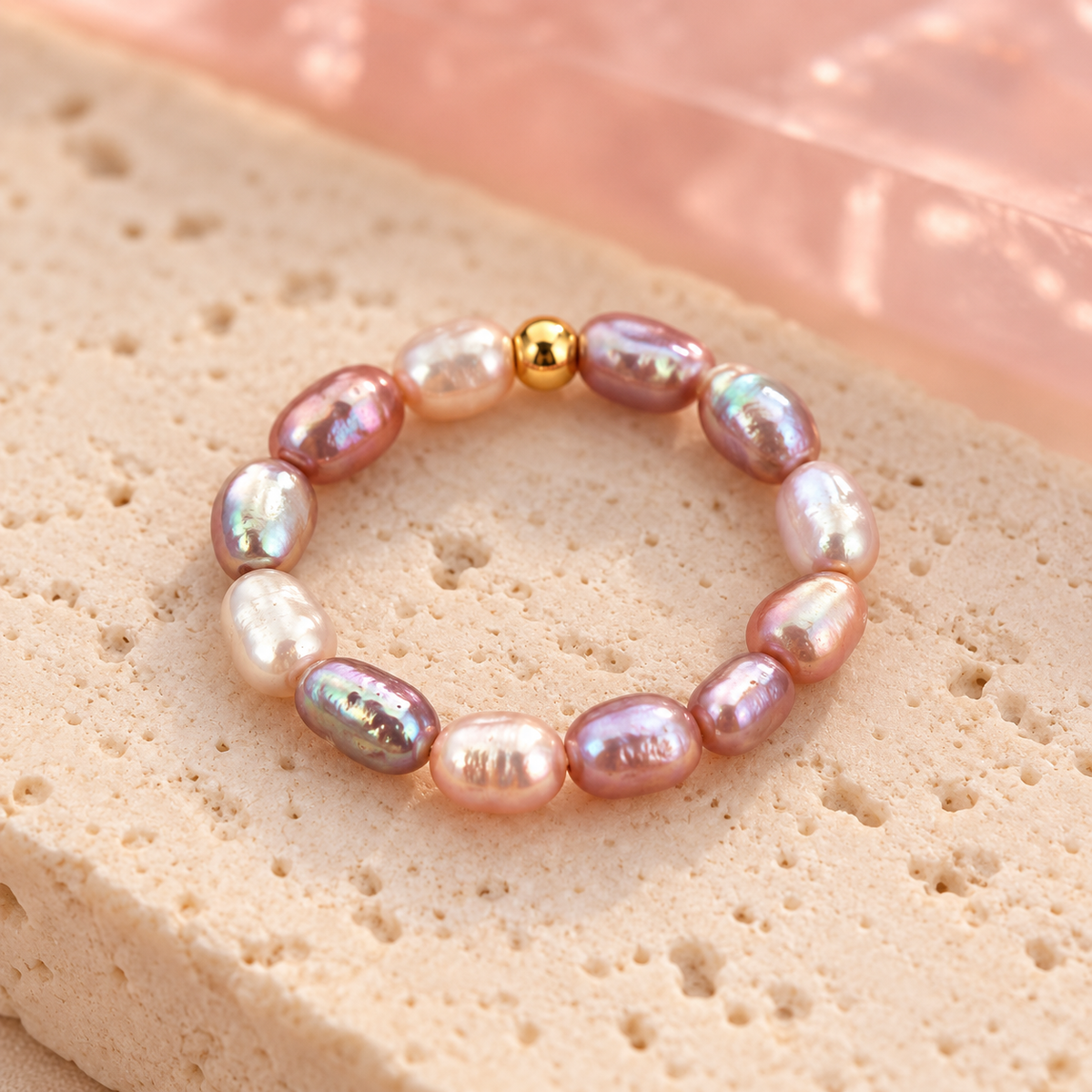 Mixed iridescent pearl ring on ivory stone
