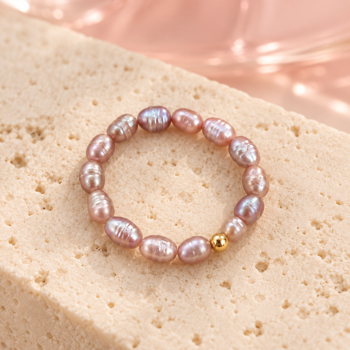 Mauve pearl ring on ivory stone