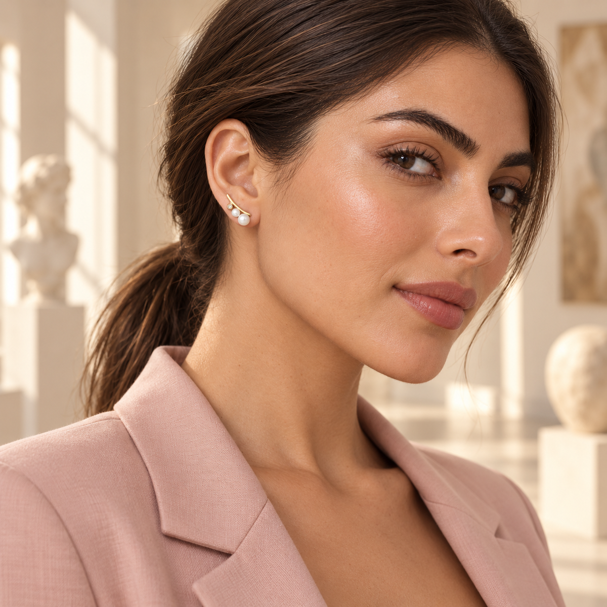 Pearl Arc Climber Earrings worn in a sunlit gallery