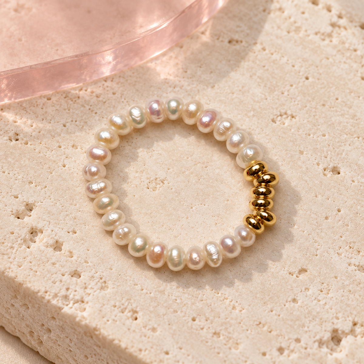 Freshwater pearl ring with a polished gold bead bar