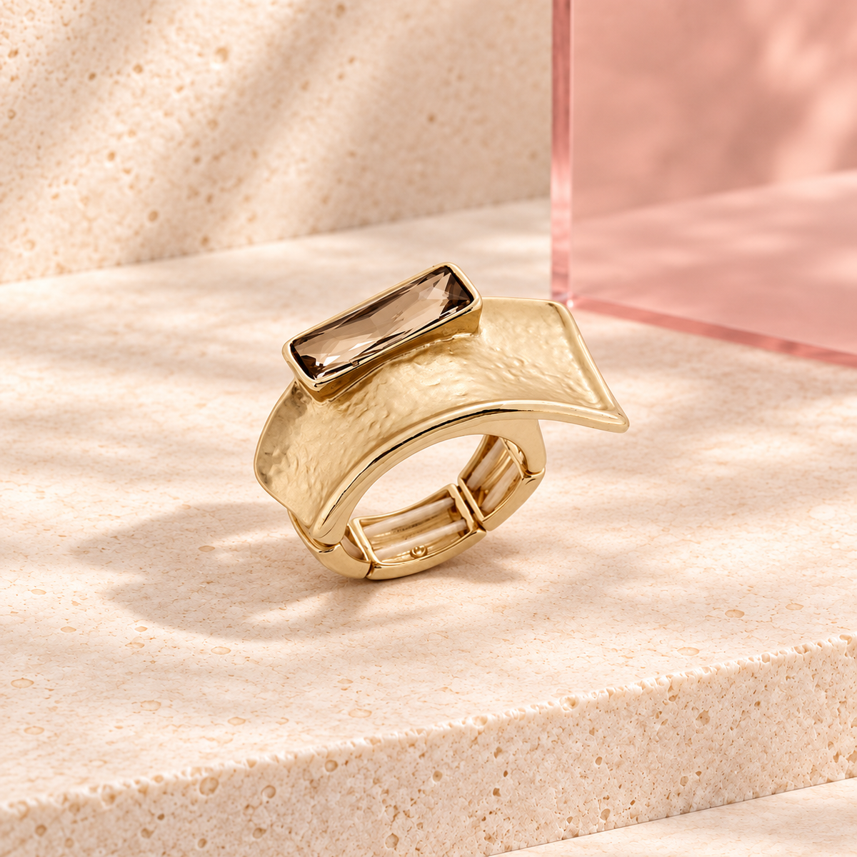 Champagne Fold statement ring on the Bloomy ivory stone display