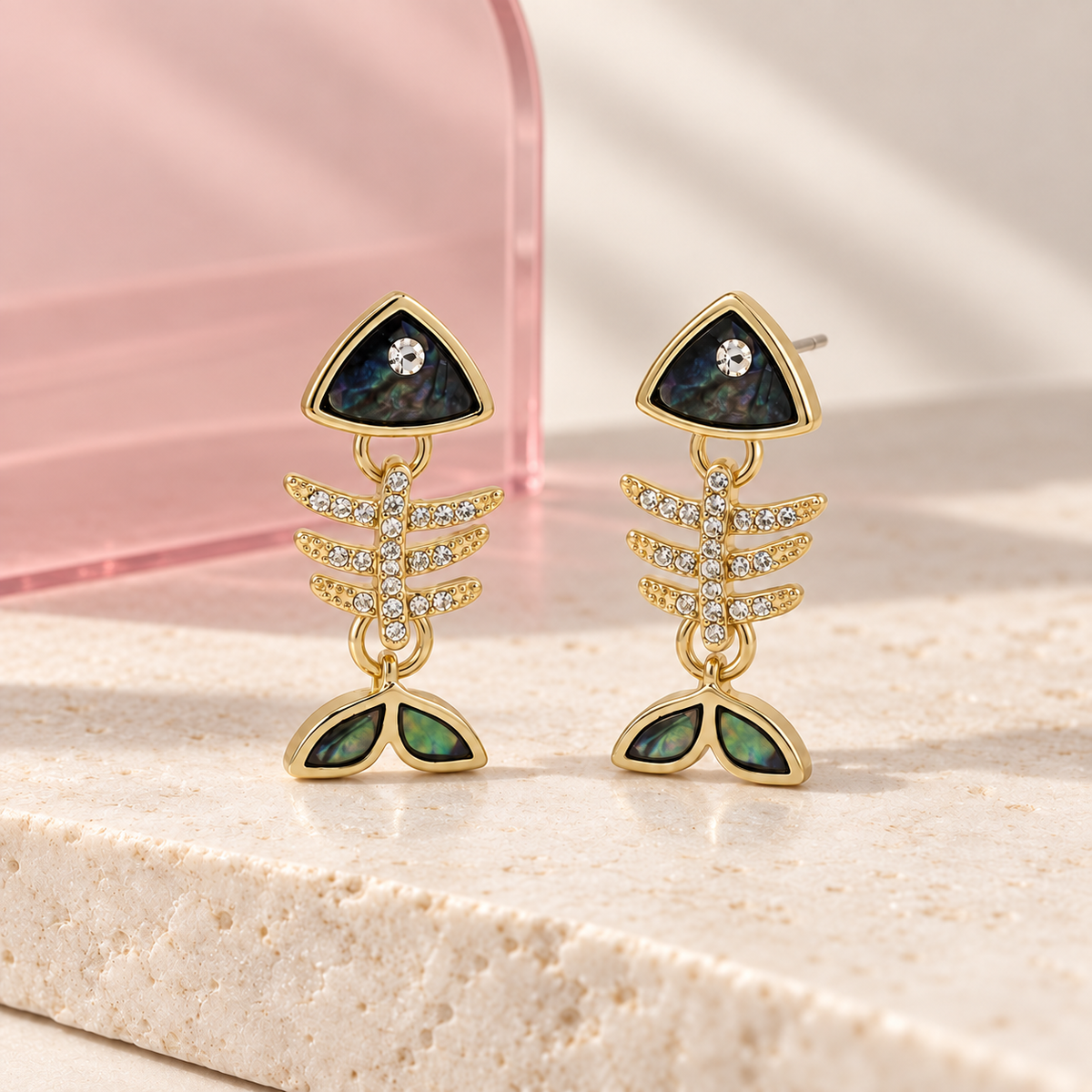 Midnight Marina fishbone earrings on the Bloomy ivory stone and blush acrylic display