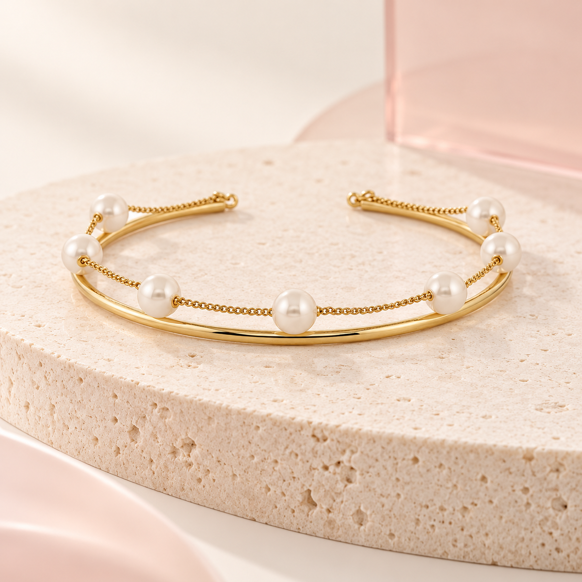 Pearl Orbit Cuff Bracelet on cream travertine