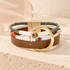 Alexa Layered Leather Bracelet on Bloomy ivory stone and blush acrylic background