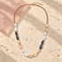 Amara Tri-Tone Long Necklace on ivory travertine