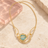 Aurelia Aqua Statement Necklace on ivory stone with blush acrylic