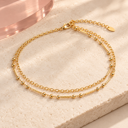 Gold-tone double-layer bead and link anklet on ivory stone