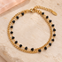 Gold-tone double-layer bracelet with tiny angular black beads