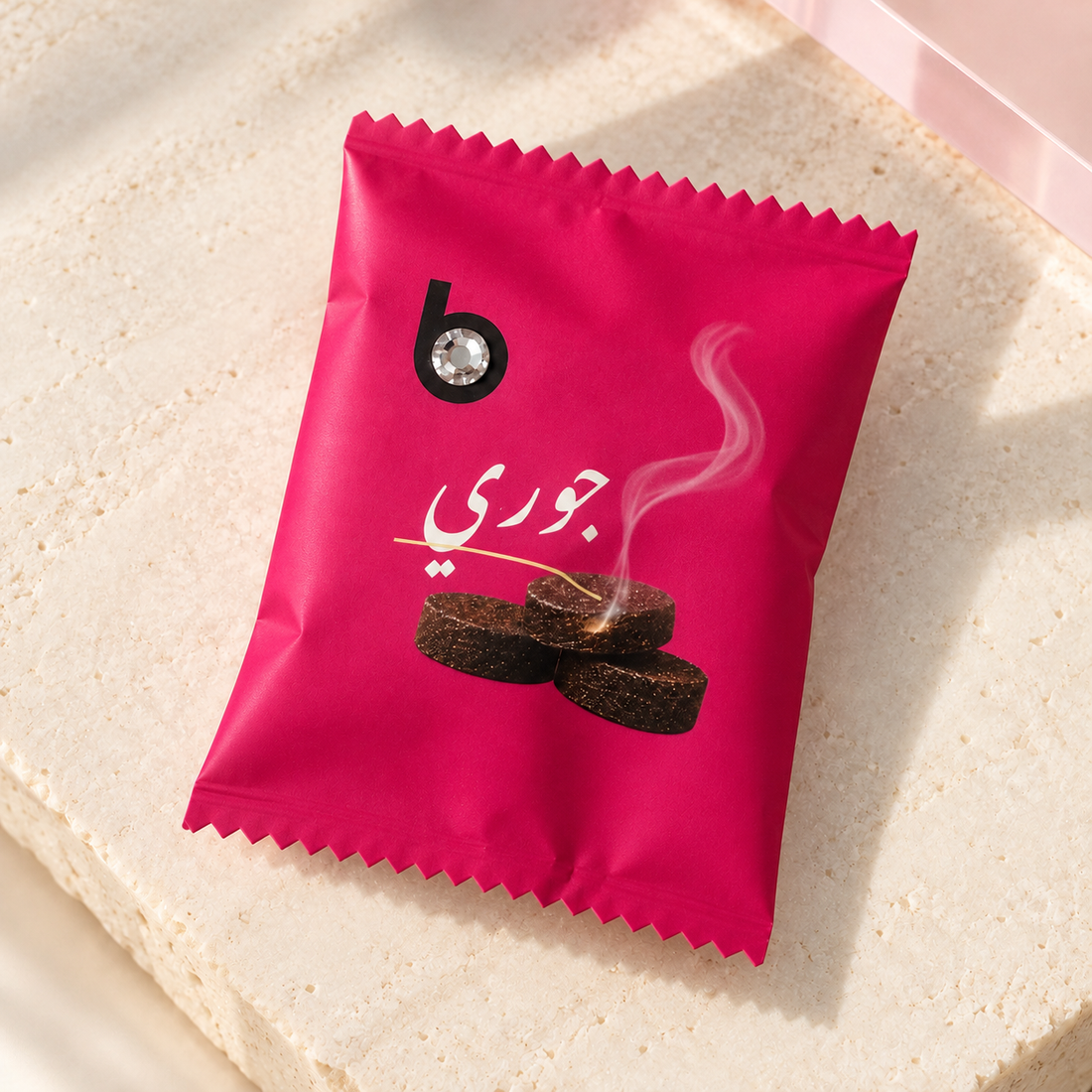 bloomy Bakhour Bonbon Jouri individually wrapped sachet on ivory stone