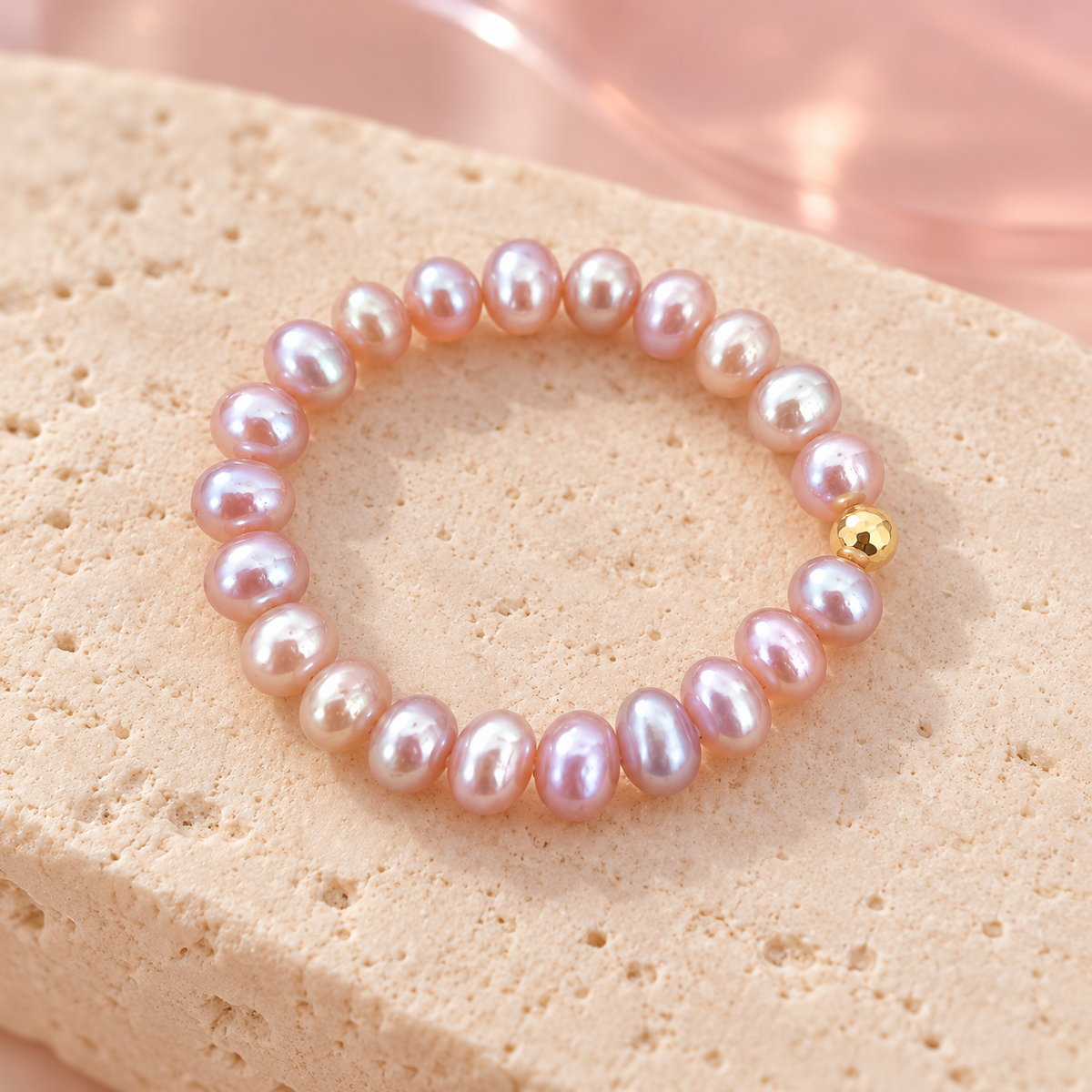 Soft pink pearl ring on ivory stone