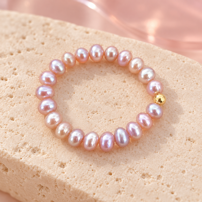 Soft pink pearl ring on ivory stone