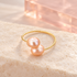 Duo Pearl Twist Ring in Peach, solo on ivory stone