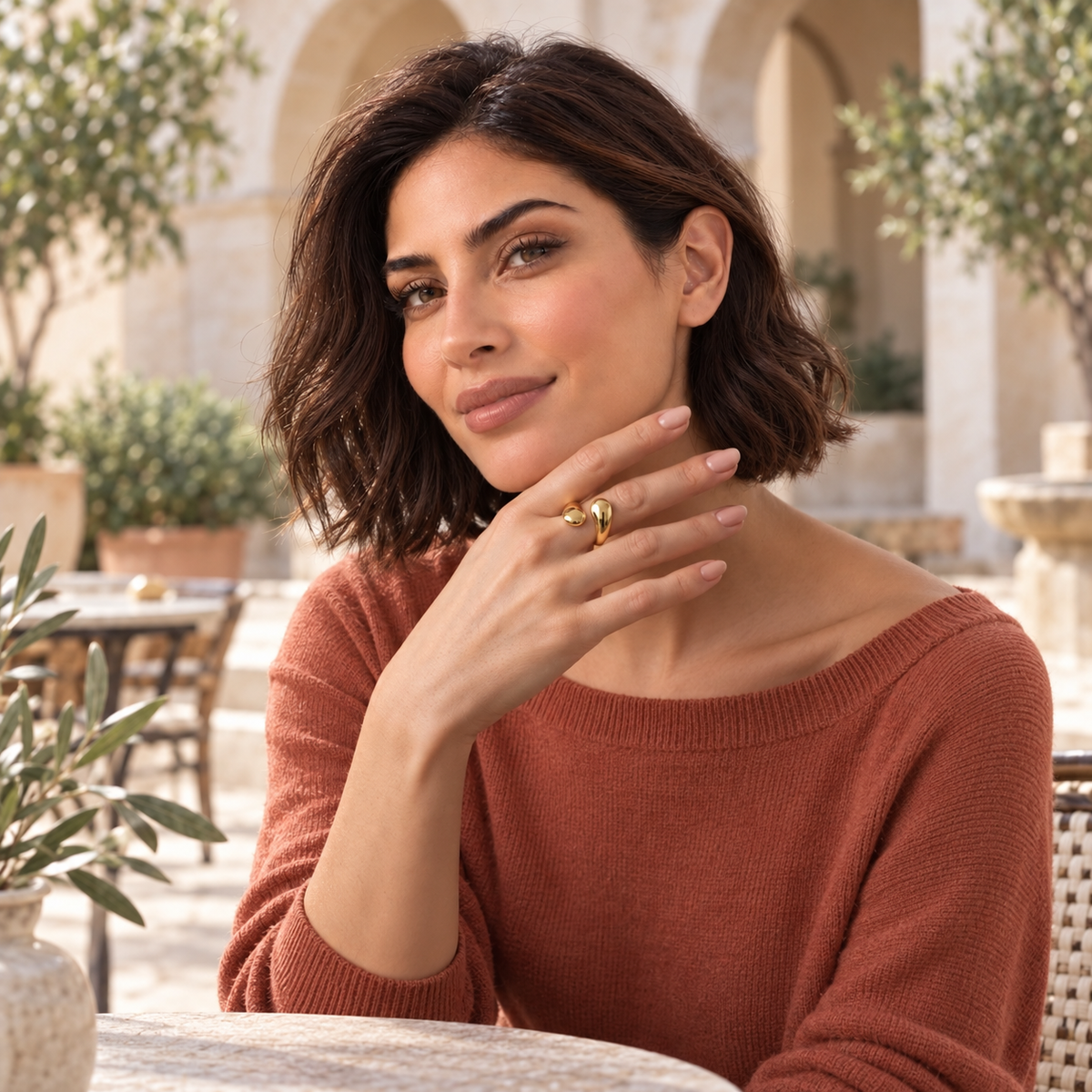 Bloomy model wearing Marea Sculpt Ring in Mediterranean courtyard