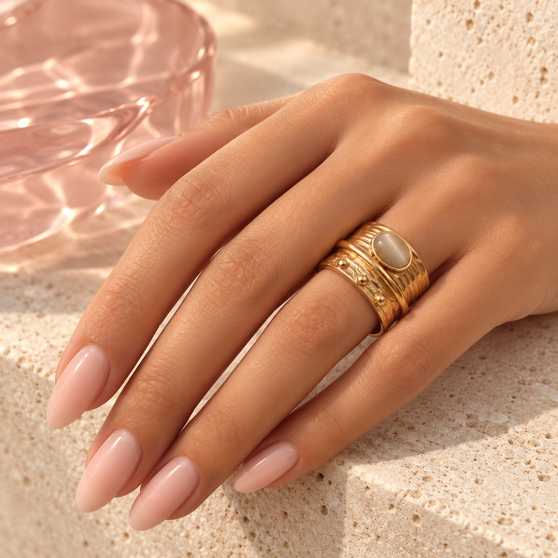 Gold cat-eye layered statement ring worn on hand