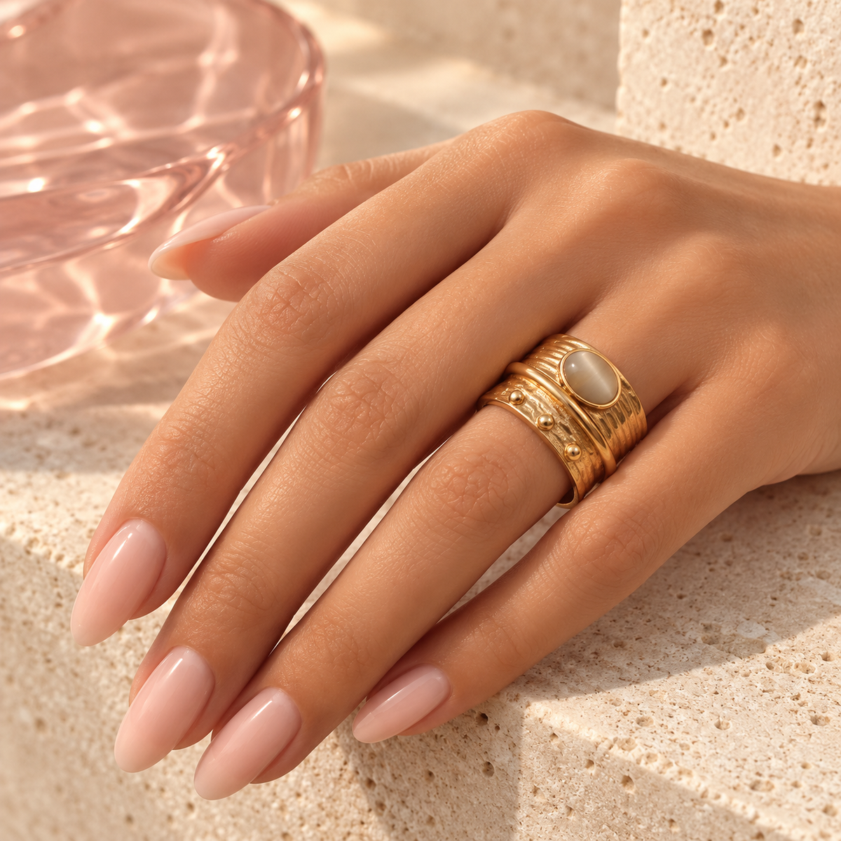 Gold cat-eye layered statement ring worn on hand
