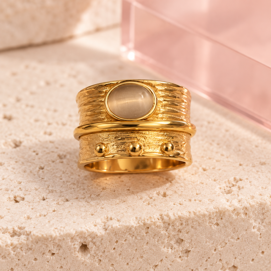 Gold cat-eye layered statement ring on Bloomy ivory stone