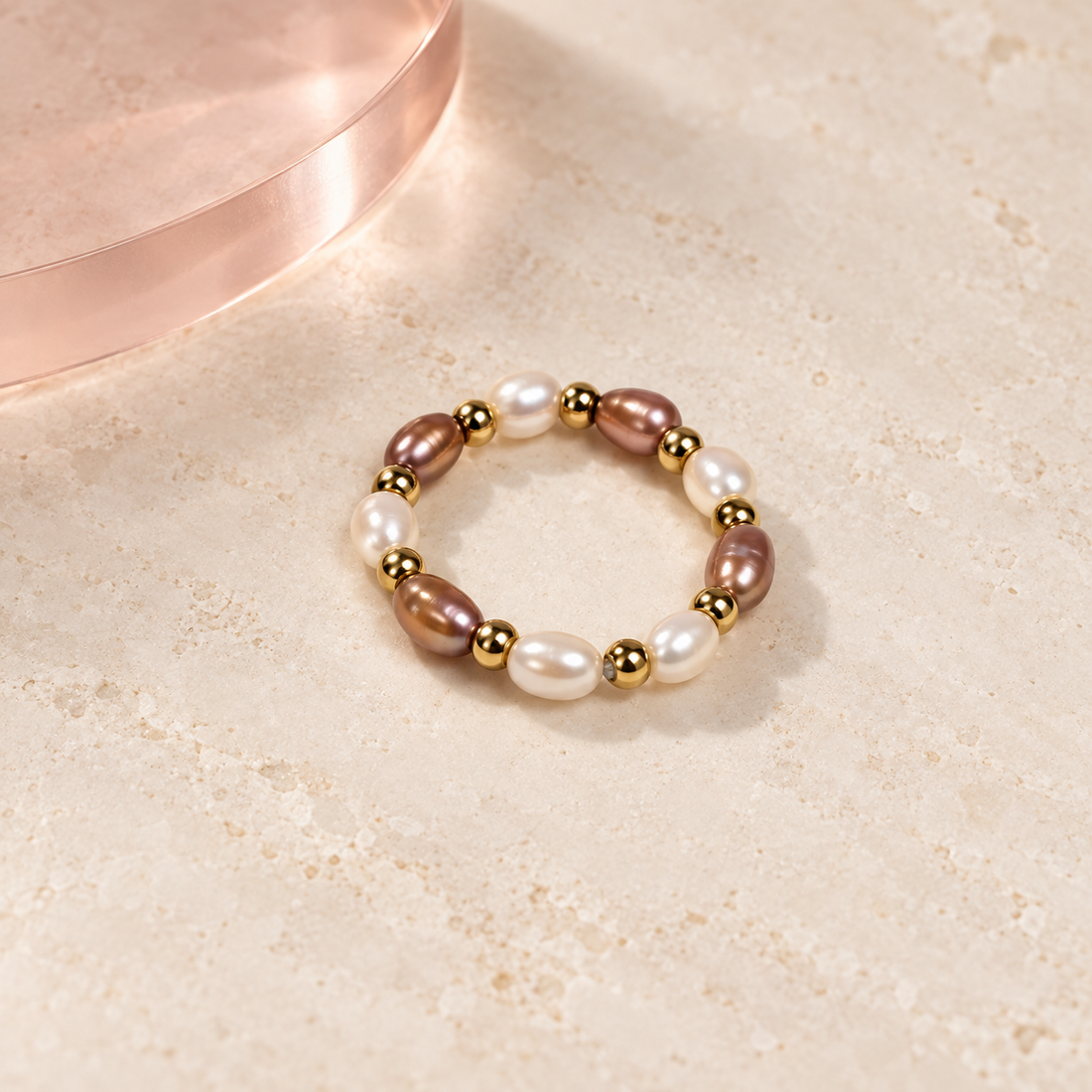 Rosé Pearl Rhythm Ring on an ivory background