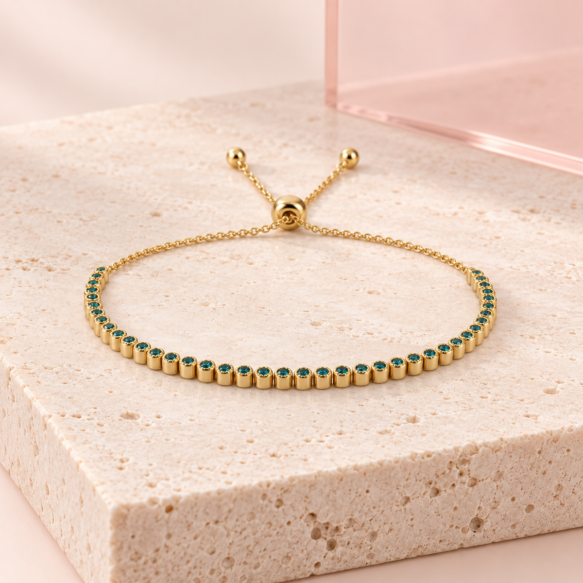 Turquoise Allure adjustable gold bracelet on Bloomy travertine display