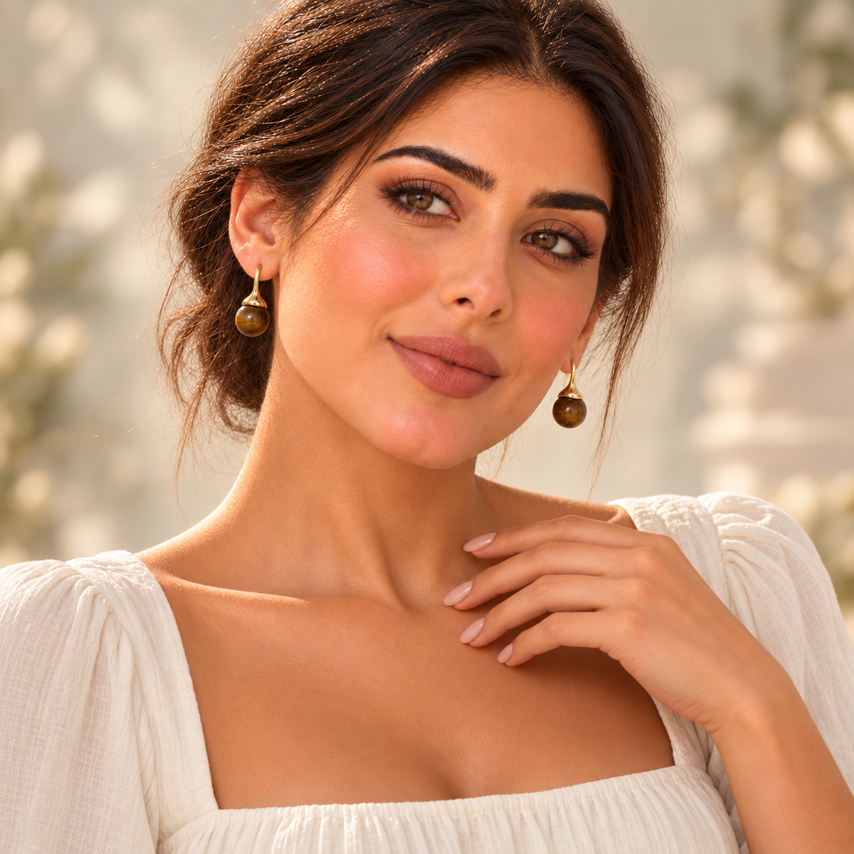 Mimi wearing golden brown bead drop earrings