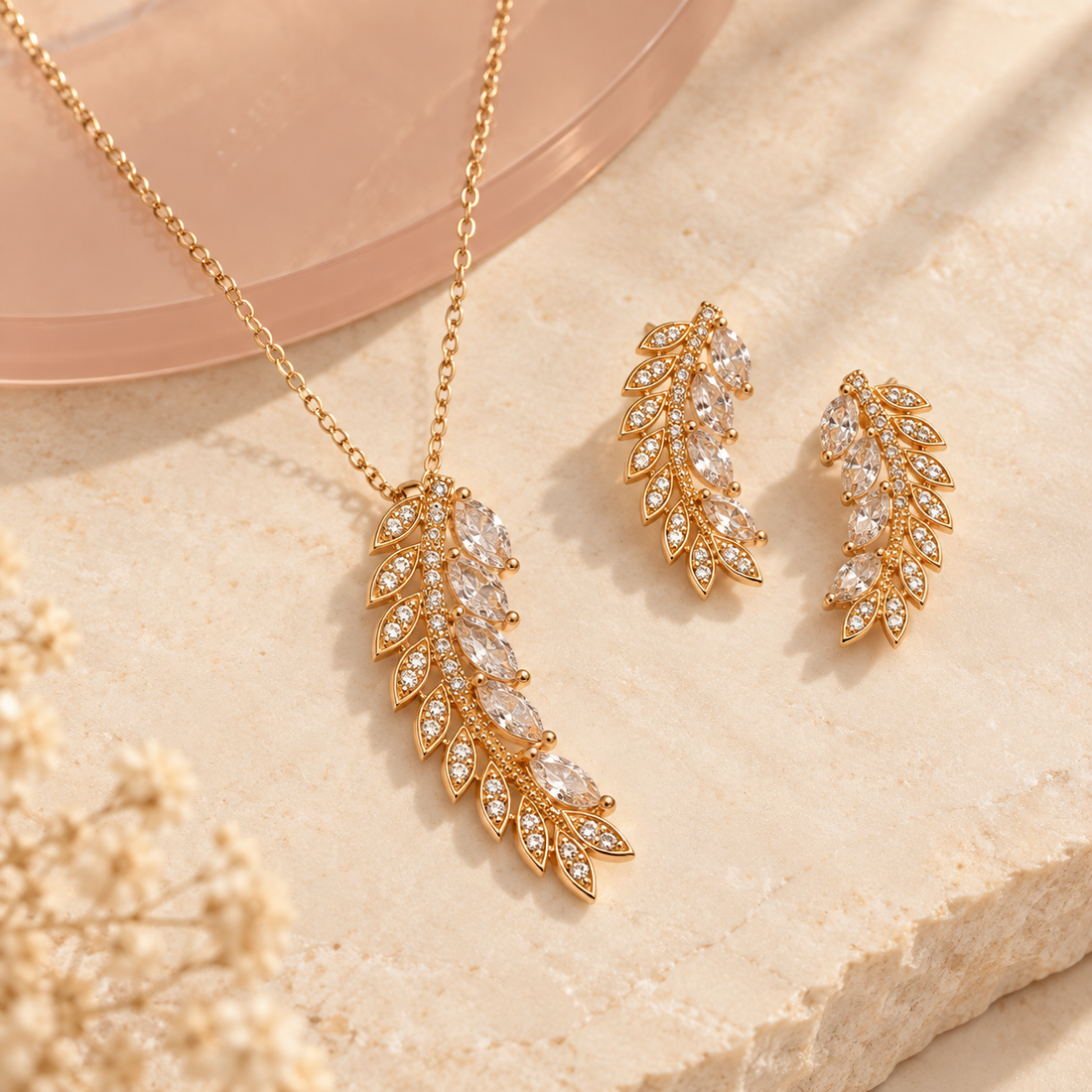 Gold-tone crystal leaf branch necklace and matching earrings