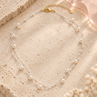 Celestia Pearl Strand Necklace on ivory stone with blush acrylic