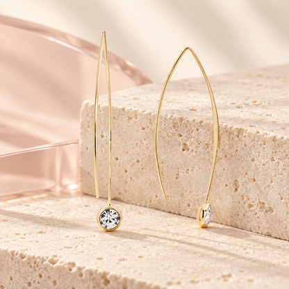 Bloomy Crystal Whisper Threader Earrings on a cream travertine display