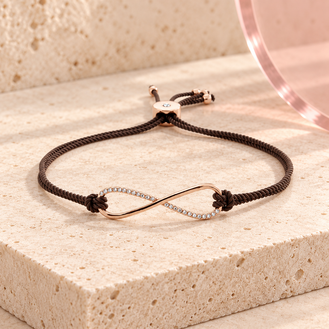 Eterna Rose infinity bracelet with brown braided cord and clear zircon