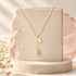 Bloomy Serena Mother-of-Pearl Drop Necklace on ivory stone and blush acrylic