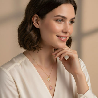 Woman wearing Bloomy Serena Mother-of-Pearl Drop Necklace with ivory blouse