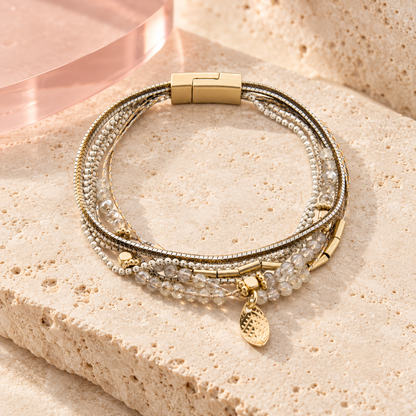 Lagoon Bracelet with crystal beads and gold-tone details on ivory travertine