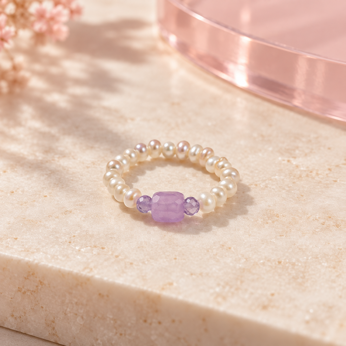 Lavender Pearl Trio Ring by Bloomy on warm ivory stone