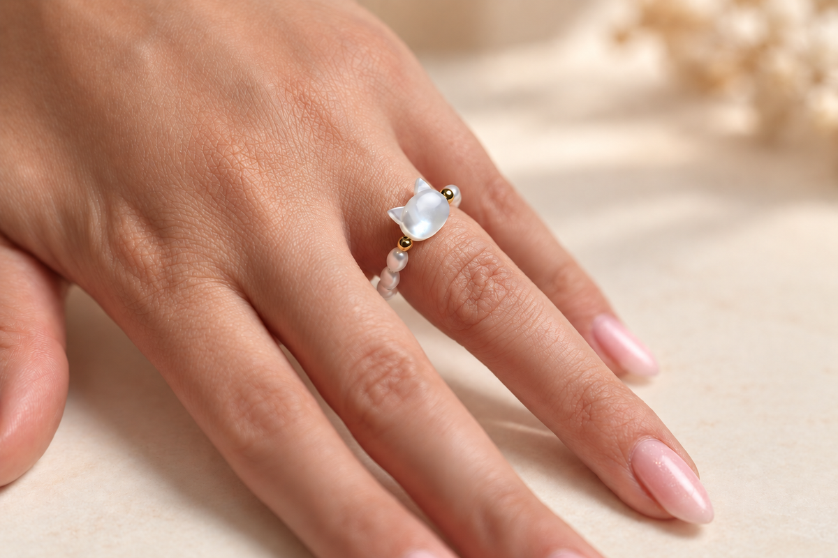 Luna Pearl Cat Ring by Bloomy worn on a softly retouched hand