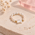 Luna Pearl Cat Ring by Bloomy on warm ivory stone