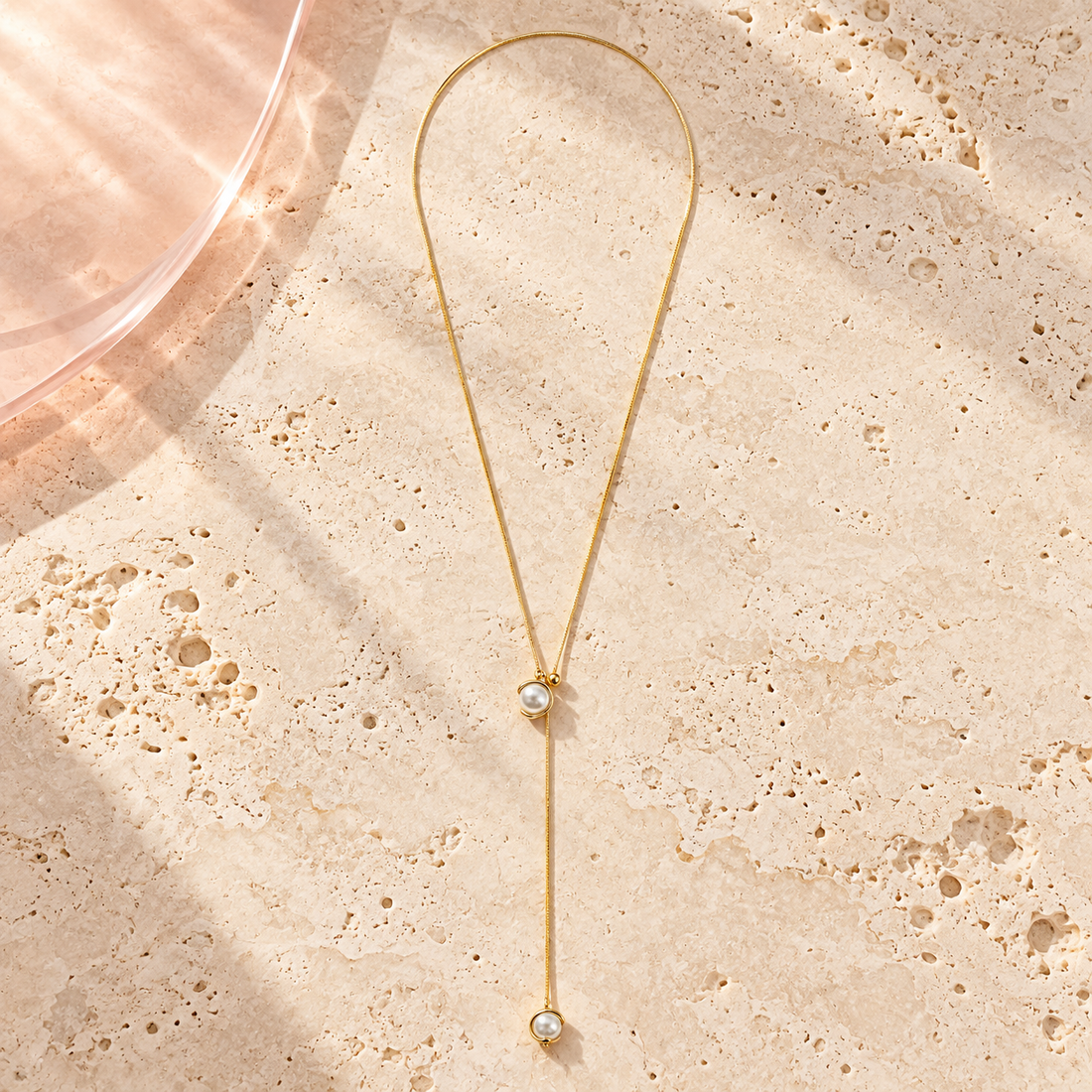 Luna Pearl Lariat Necklace by Bloomy on ivory stone