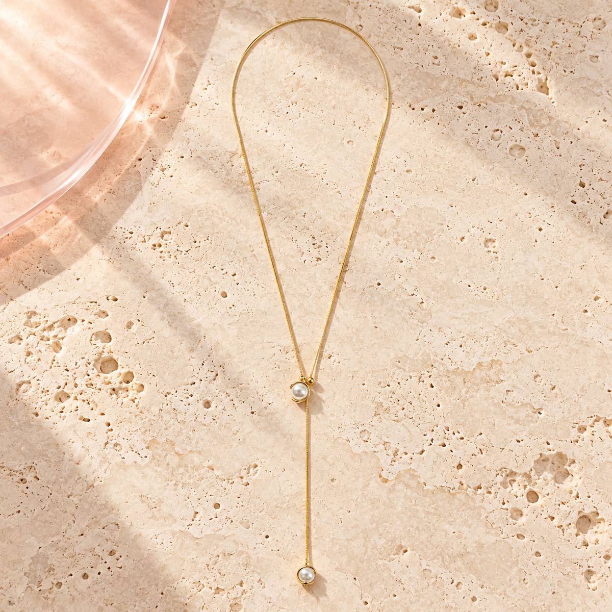 Luna Pearl Lariat Necklace by Bloomy on ivory stone