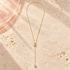 Luna Pearl Lariat Necklace by Bloomy on ivory stone