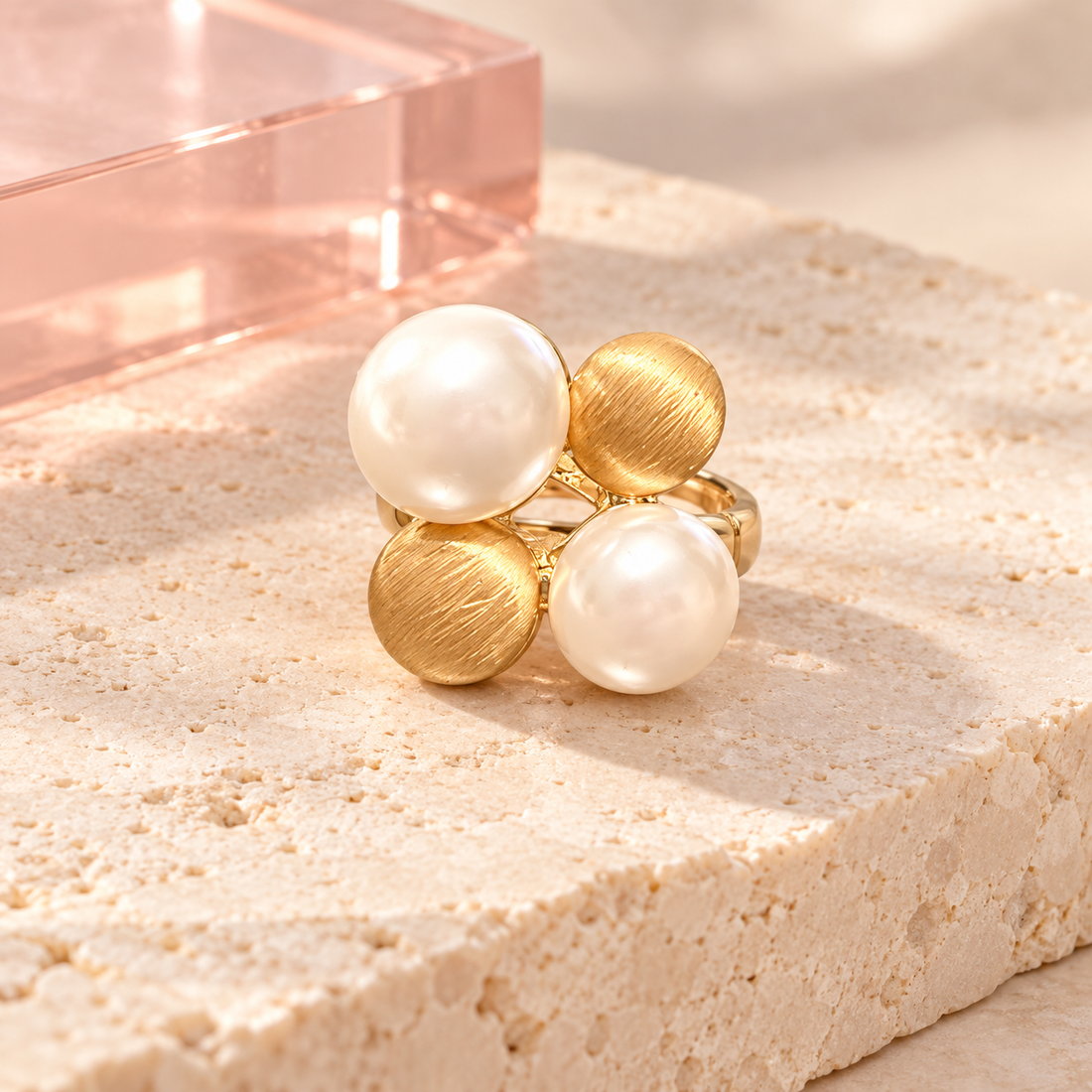 Play Pearl Gold Ring with two pearls and two brushed gold discs on ivory stone with blush acrylic