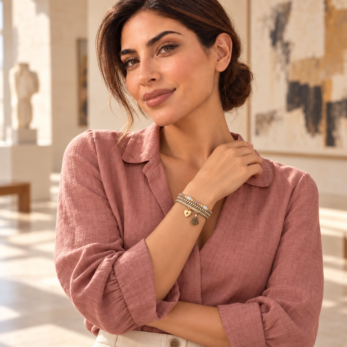 Bloomy model wearing the taupe Bohemian Starlight leather bracelet in an art gallery