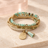 Seafoam Mosaic Beaded Bracelet on Bloomy ivory stone and blush acrylic background