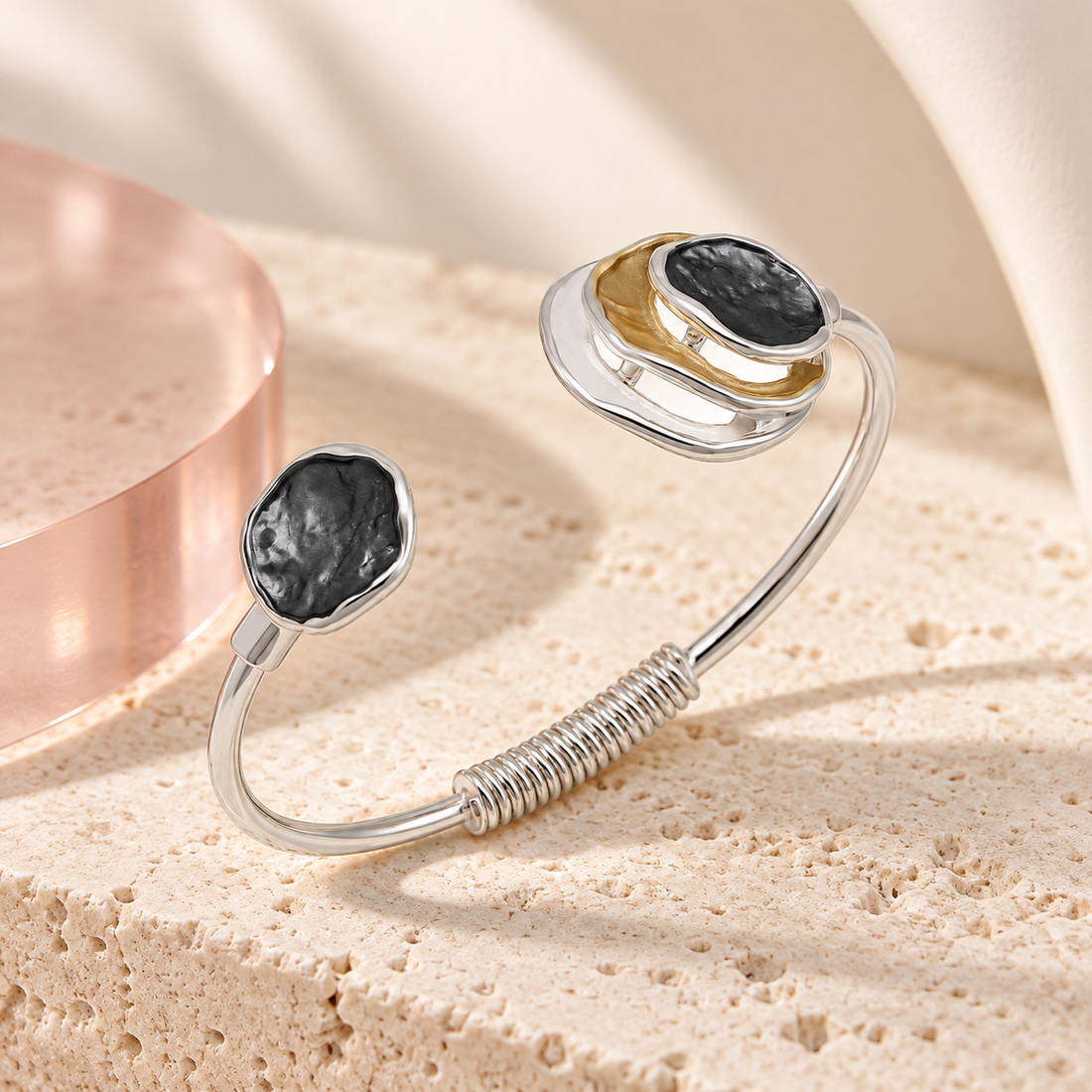 Bloomy Trinity Eclipse Cuff Bracelet on cream travertine