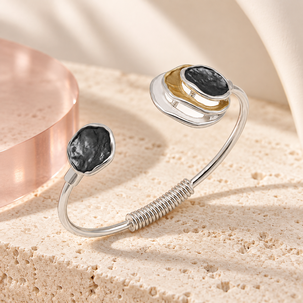 Bloomy Trinity Eclipse Cuff Bracelet on cream travertine