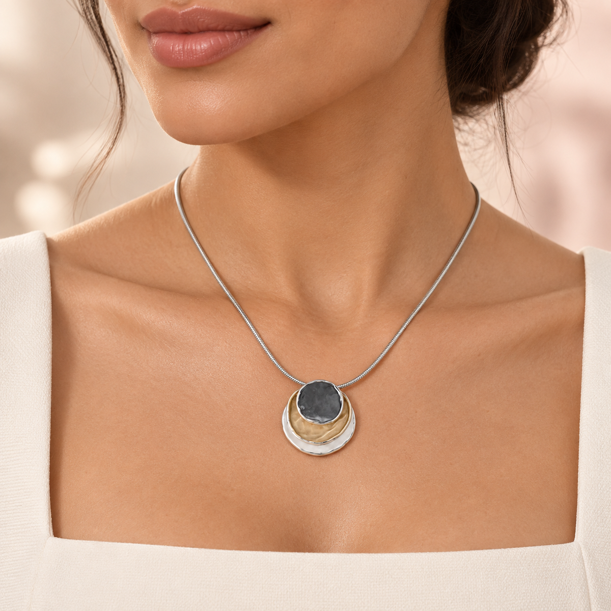 Close-up of Trinity Eclipse Necklace with a square neckline
