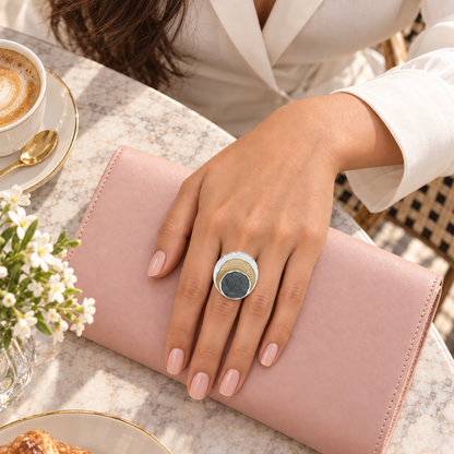 Trinity Eclipse Statement Ring styled at a refined cafe
