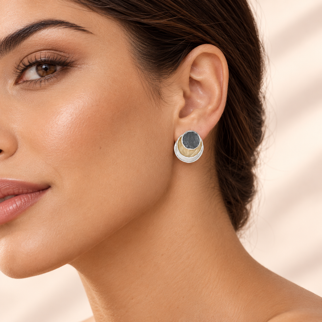 Close-up of Trinity Eclipse Stud Earrings worn on a model